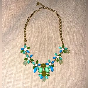 Costume jewelry, gold with diamonds, blue and green stones.